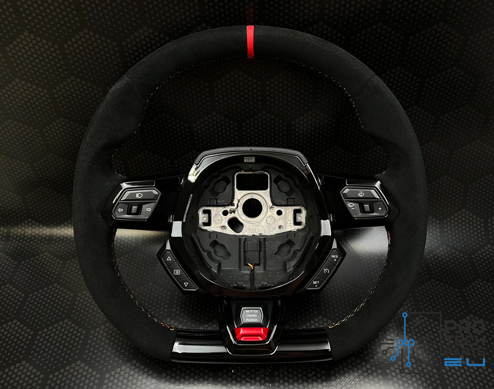 a steering wheel with a black and red stitching